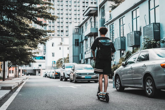Electric scooter rider on a city street