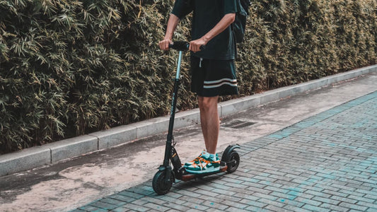 Electric scooter rider on an everyday outdoor route