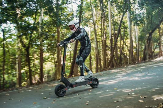 KuKirin long range electric scooter riding on a forest road